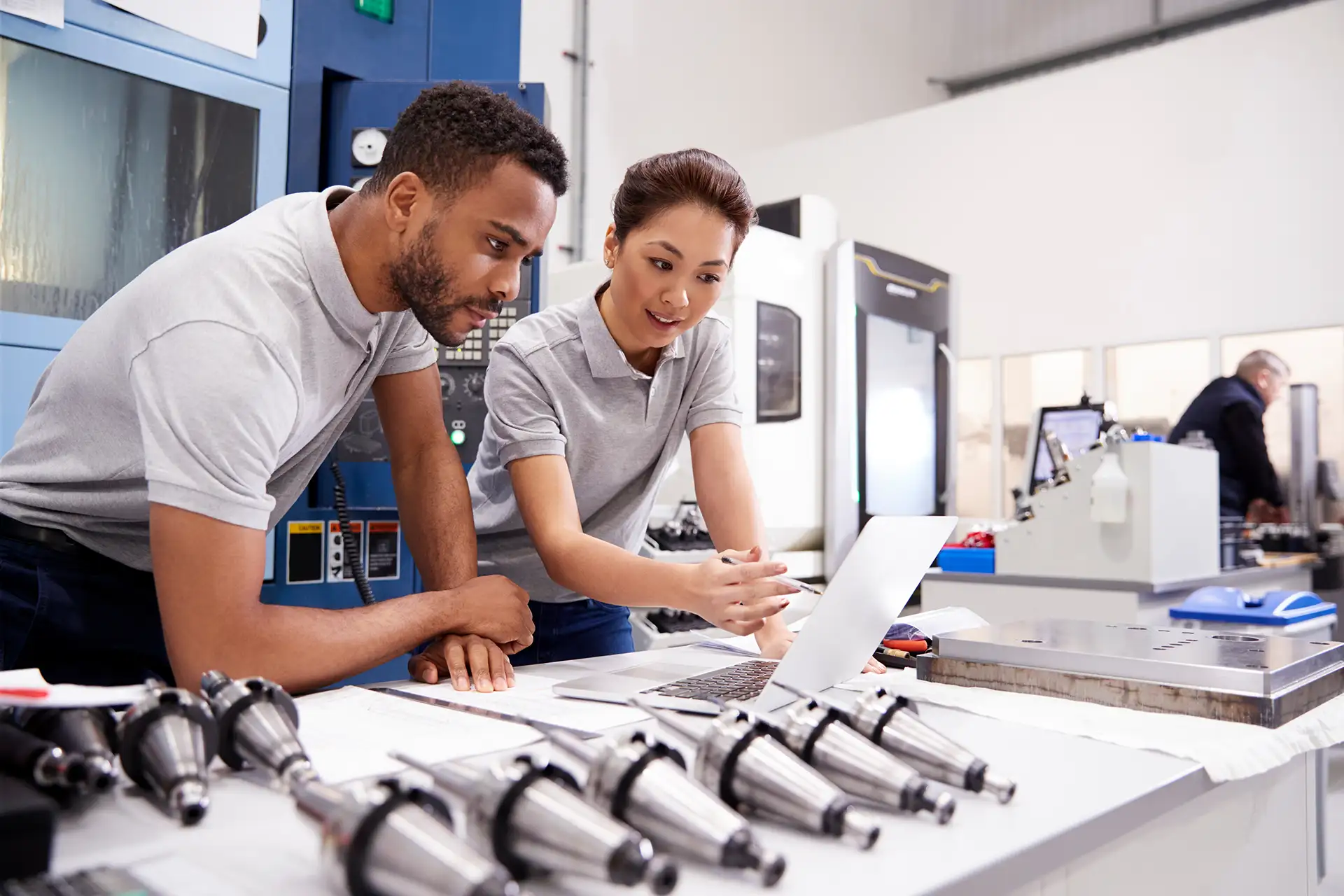 Manufacturing team reviewing data on shop floor